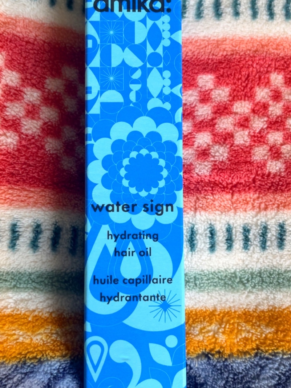 amika Water Sign Hydrating Hair Oil — Bright Blue Packaging